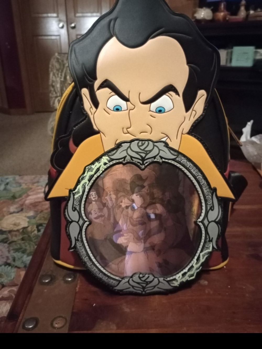 Holograph shows Belle alt. with Beast. Backpack 11 in tall plus 2 in face cutou